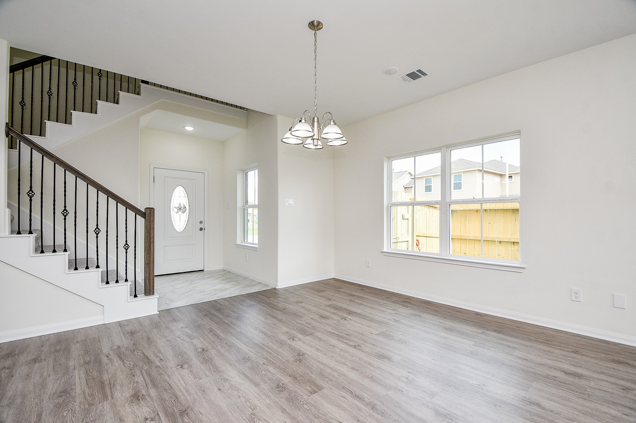 2803 Bowlin Leaf Lane Houston, TX 77014 - Photo 6 of 28 a view of a livingroom with wooden floor and a window