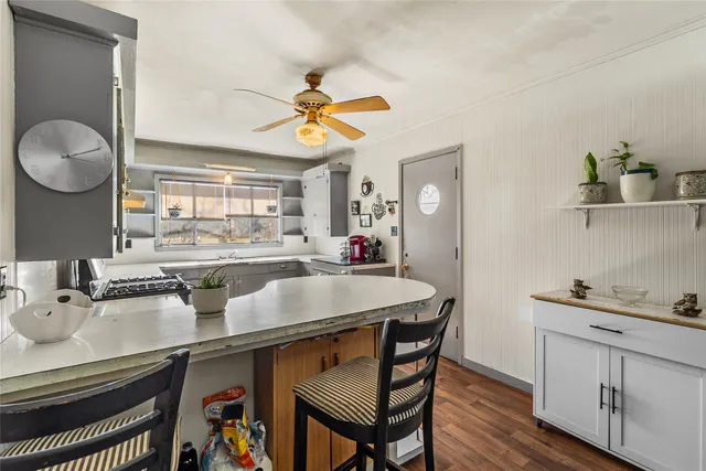 a kitchen with a table and chairs in it