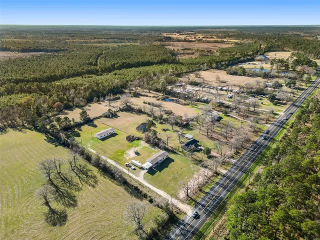 an aerial view of residential building and ocean