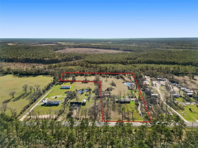 an aerial view of residential building and lake