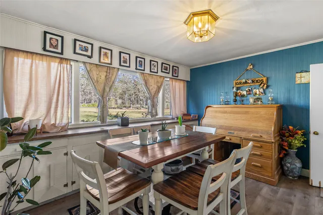 a view of a dining room with furniture window and outside view