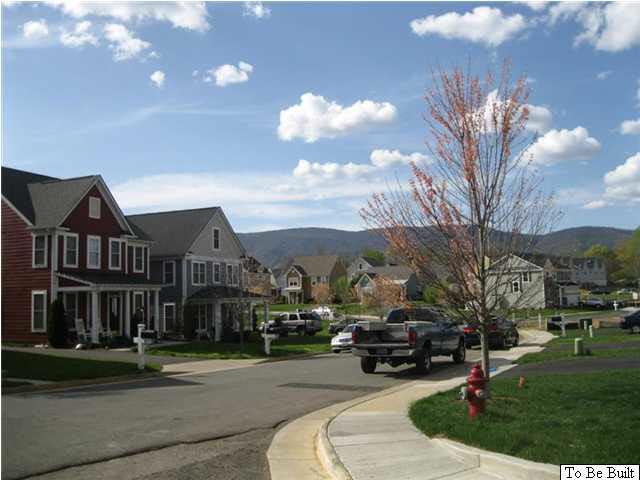 5530 Summerdean Road Crozet, VA 22932 - Photo 12 of 17 a roof deck view with building and trees in the background