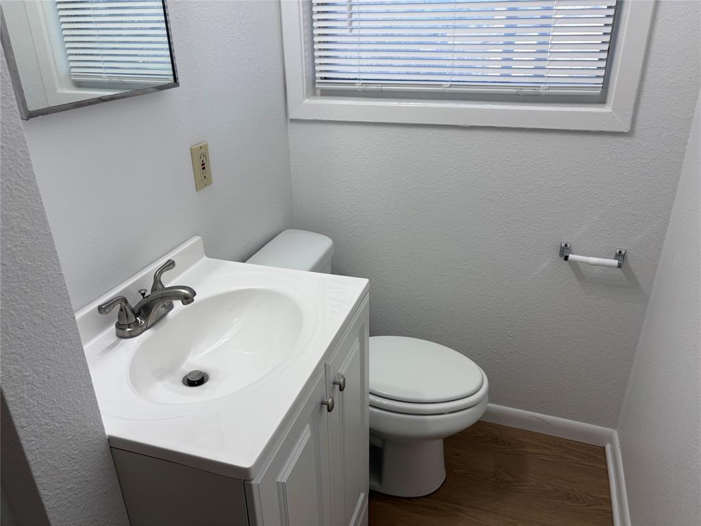 3601 Slade Boulevard Fort Worth, TX 76116 - Photo 8 of 14 a bathroom with a sink and a toilet