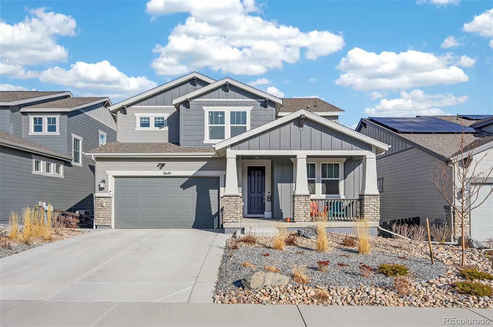 3649 Rucksack Court Castle Rock, CO 80108 - Photo 1 of 48 a front view of a house with a yard