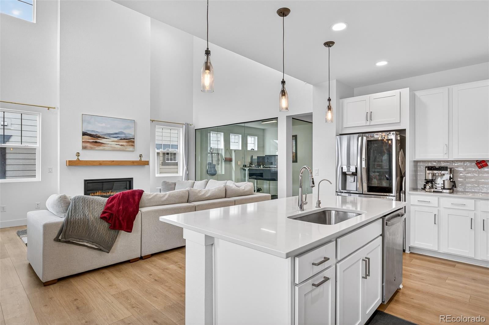 3649 Rucksack Court Castle Rock, CO 80108 - Photo 14 of 48 a kitchen with stainless steel appliances granite countertop a sink and refrigerator