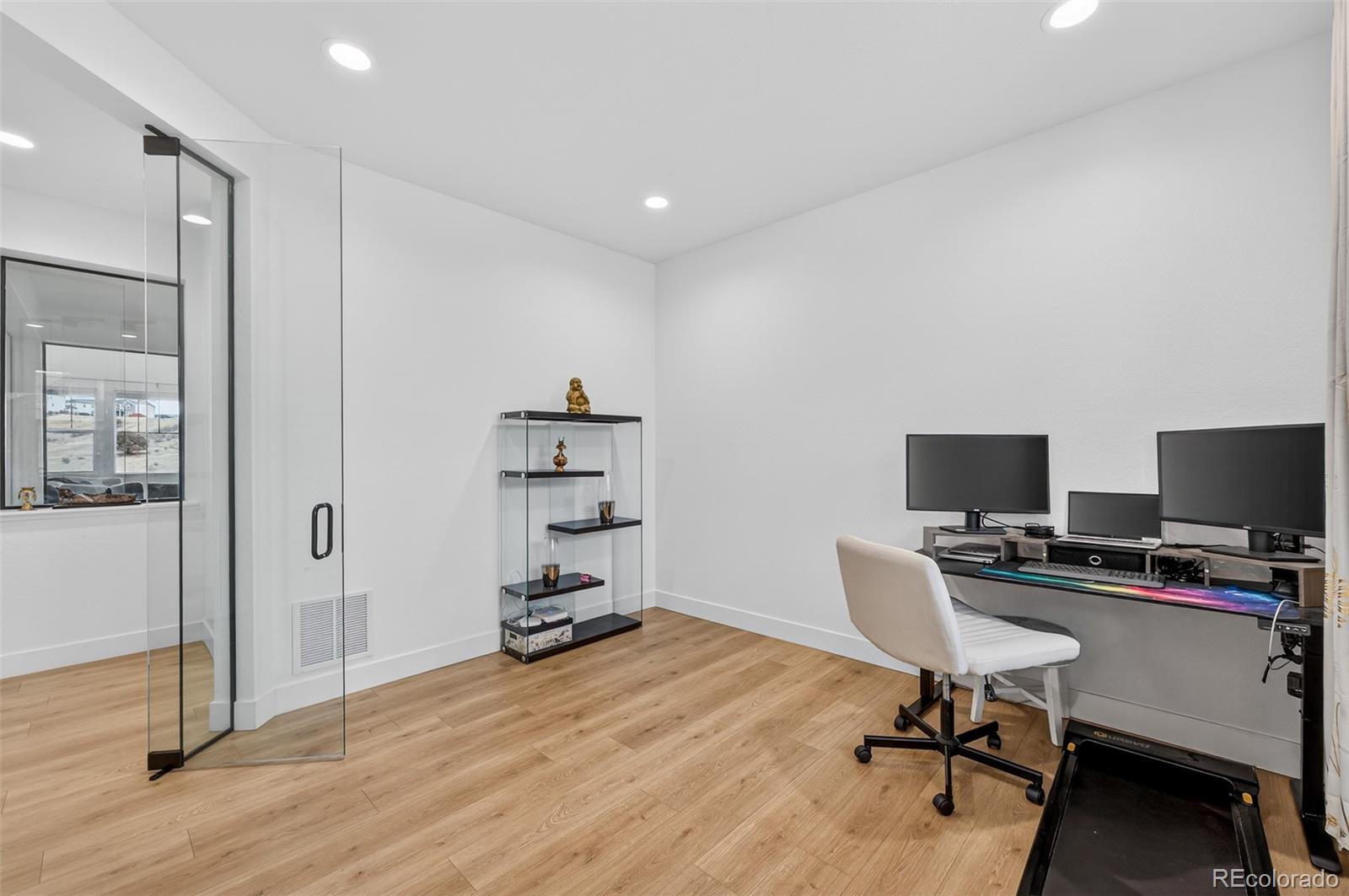 3649 Rucksack Court Castle Rock, CO 80108 - Photo 20 of 48 a view of a workspace with furniture and wooden floor