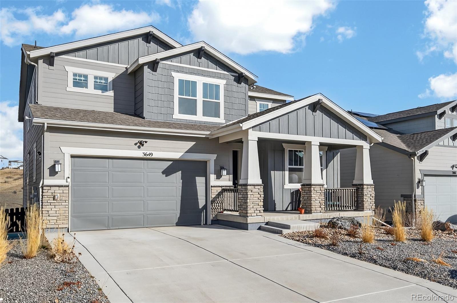 3649 Rucksack Court Castle Rock, CO 80108 - Photo 2 of 48 a front view of a house with garage