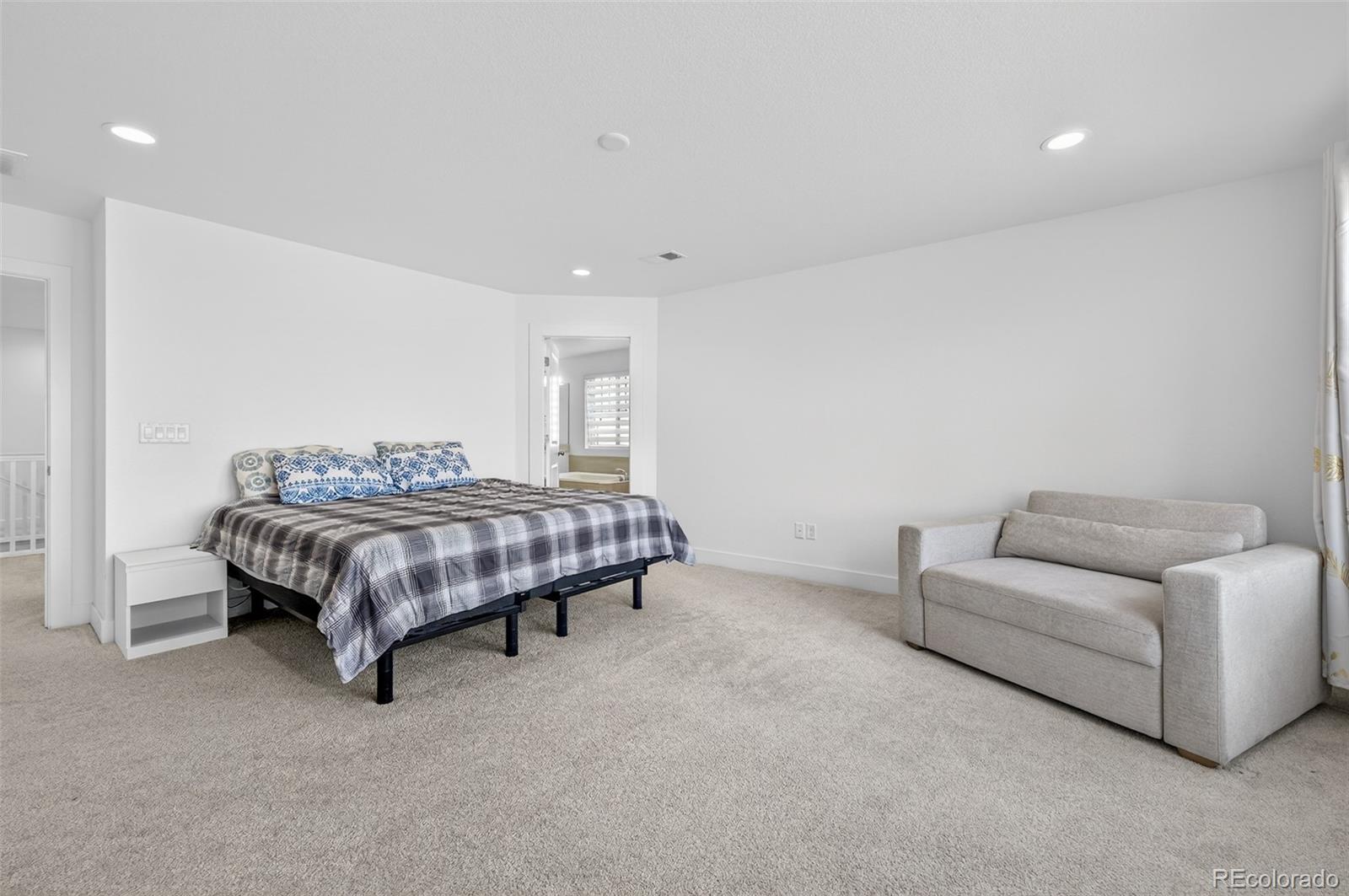 3649 Rucksack Court Castle Rock, CO 80108 - Photo 26 of 48 a bedroom with a bed and a couch