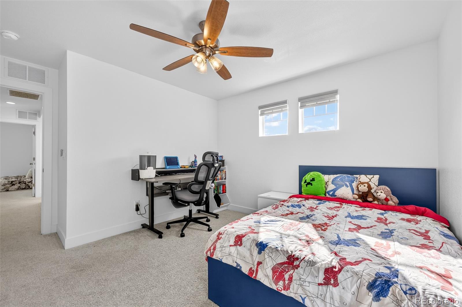 3649 Rucksack Court Castle Rock, CO 80108 - Photo 34 of 48 a bedroom with a bed and a table in it