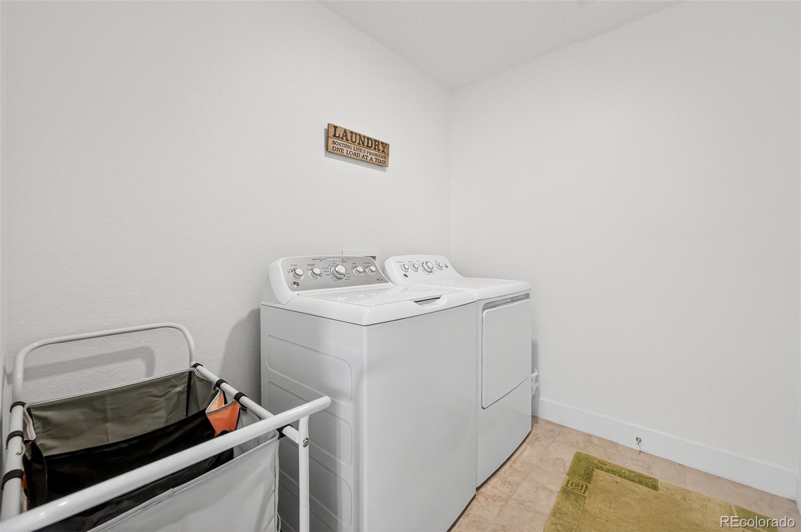 3649 Rucksack Court Castle Rock, CO 80108 - Photo 35 of 48 a utility room with dryer and washer