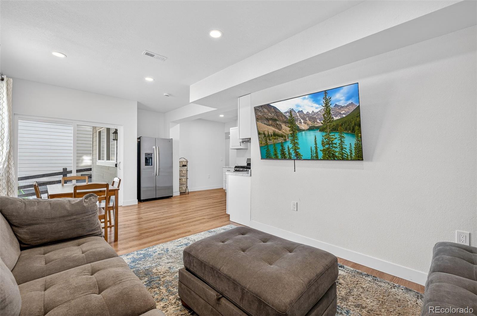 3649 Rucksack Court Castle Rock, CO 80108 - Photo 39 of 48 a living room with furniture and a flat screen tv