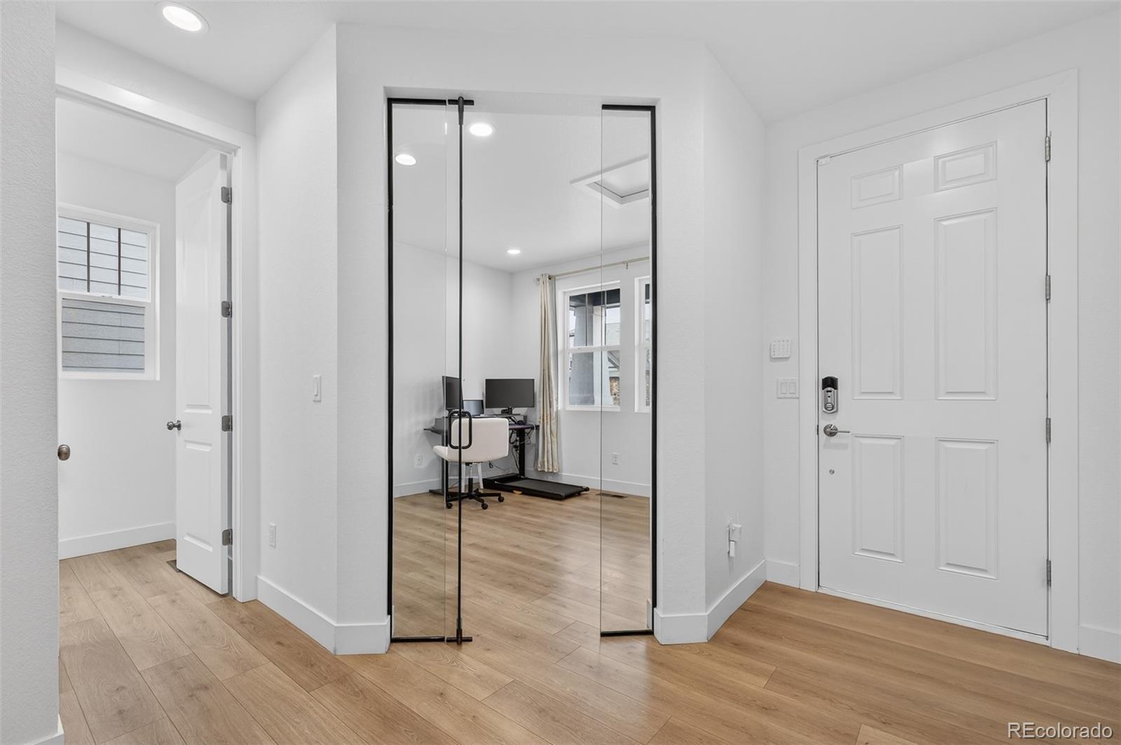3649 Rucksack Court Castle Rock, CO 80108 - Photo 5 of 48 a view of a livingroom with a furniture and a ceiling fan