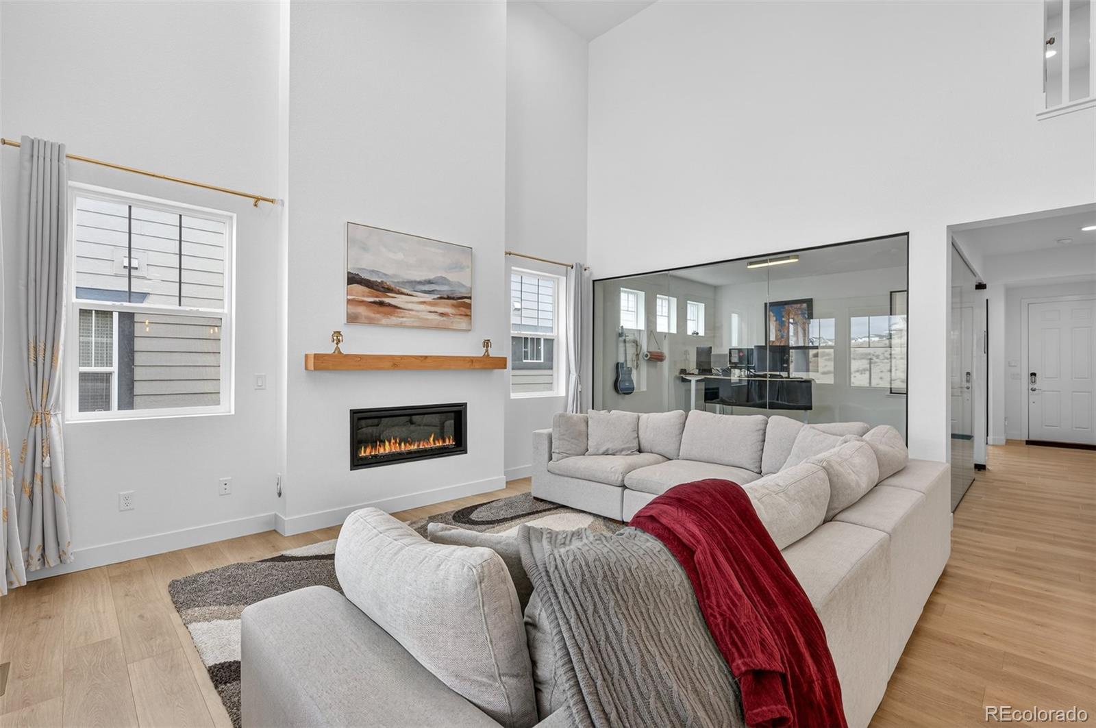 3649 Rucksack Court Castle Rock, CO 80108 - Photo 8 of 48 a living room with furniture and a fireplace