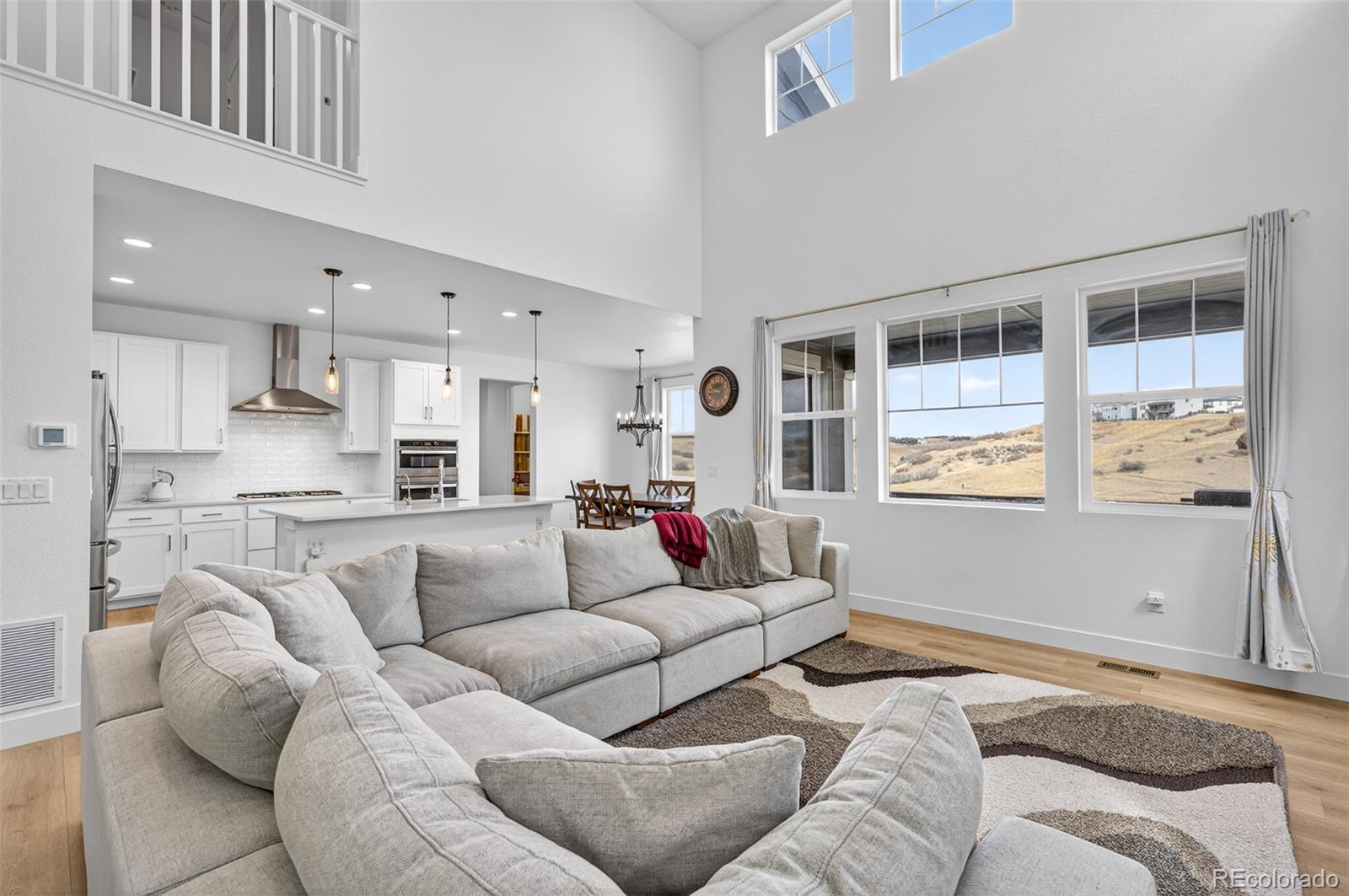 3649 Rucksack Court Castle Rock, CO 80108 - Photo 10 of 48 a living room with furniture and a large window
