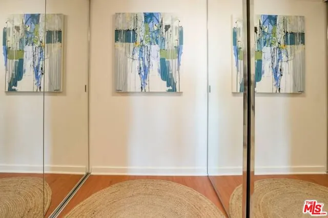 view of the room with wooden floor and wall