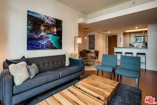 a living room with furniture and a rug