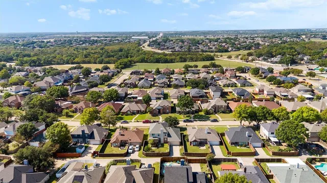 an aerial view of a city with lots of residential buildings