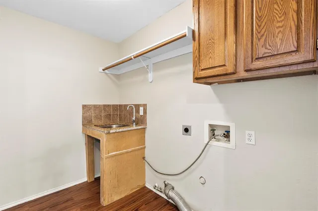 a view of a storage & utility room with wooden floor