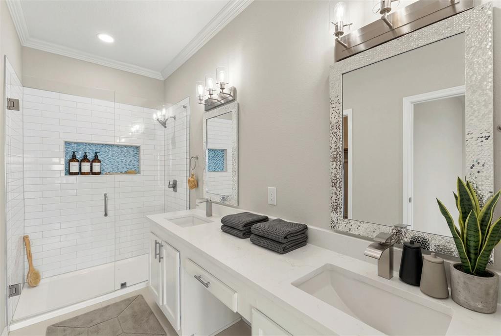 1916 Signal Ridge Place Rockwall, TX 75032 - Photo 13 of 32 Virtually stagedVirtually staged Bathroom featuring a stall shower, double vanity, and crown molding