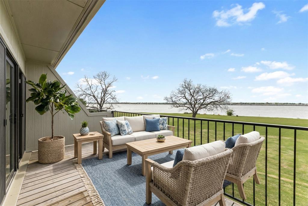 1916 Signal Ridge Place Rockwall, TX 75032 - Photo 19 of 32 Virtually staged Balcony featuring an outdoor hangout area and a water view