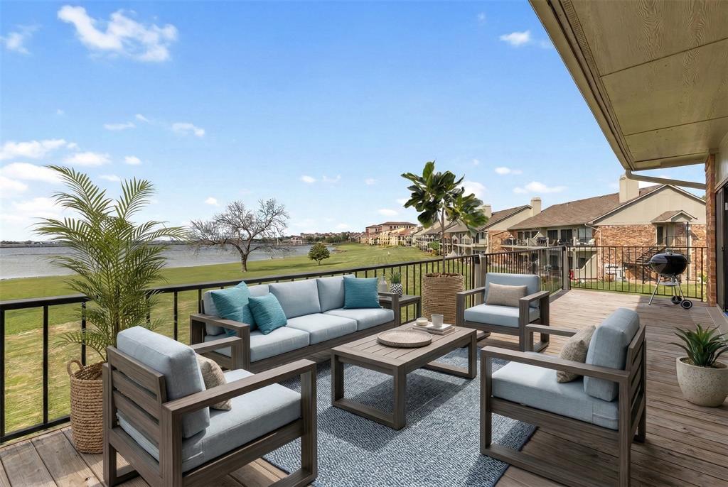 1916 Signal Ridge Place Rockwall, TX 75032 - Photo 20 of 32 Wooden deck with grilling area, a lawn, and an outdoor hangout area