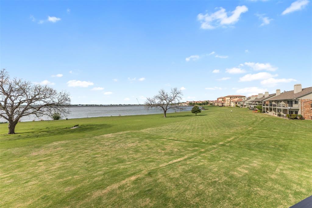 1916 Signal Ridge Place Rockwall, TX 75032 - Photo 23 of 32 View of green lawn with a water view