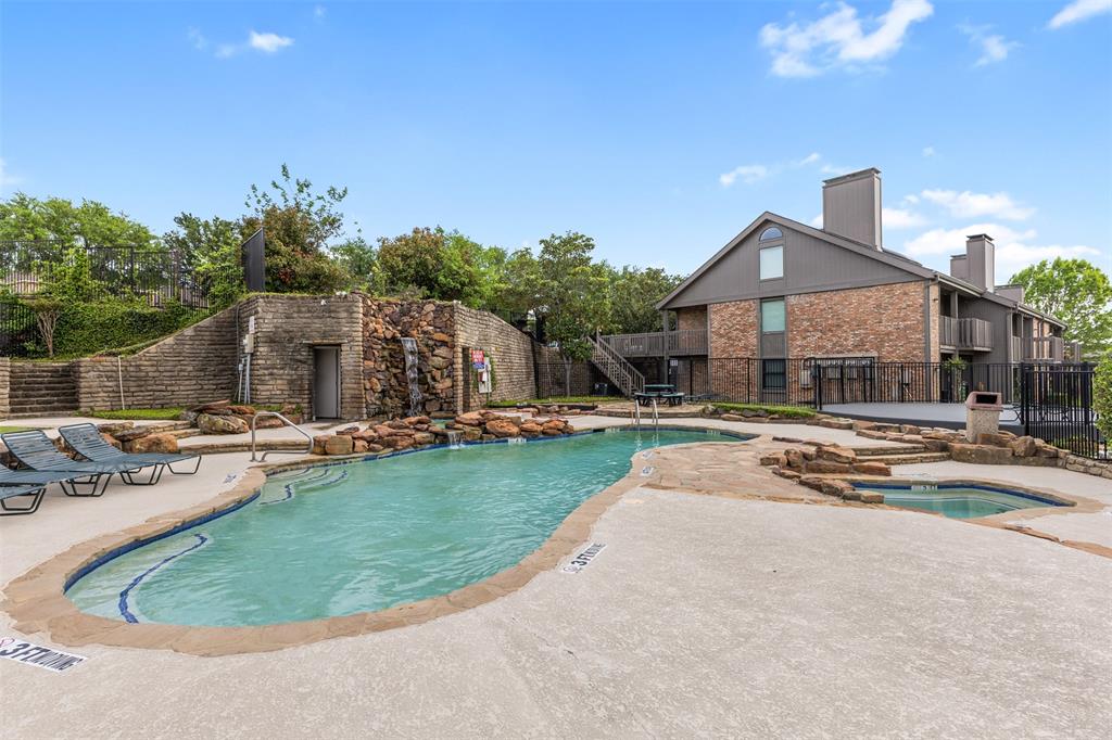 1916 Signal Ridge Place Rockwall, TX 75032 - Photo 27 of 32 Community pool with a patio and a balcony