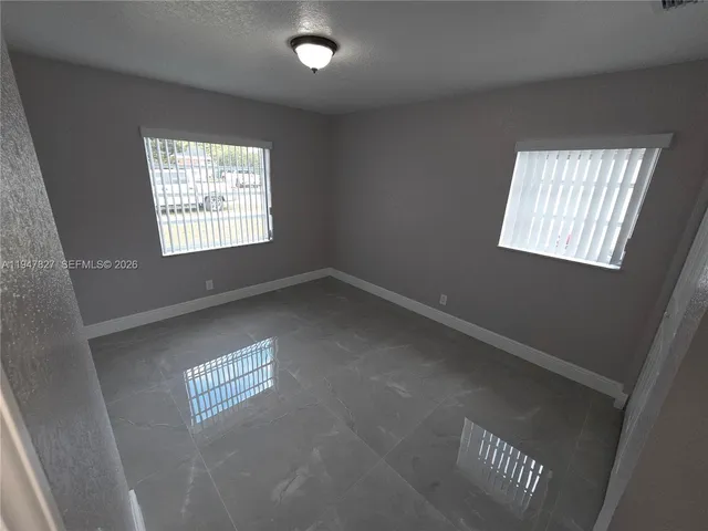 a view of an empty room and window
