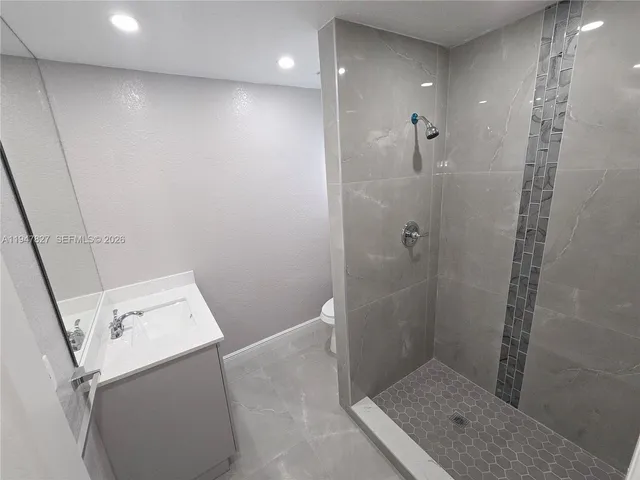 a bathroom with a sink and shower