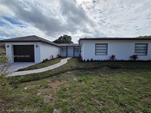a house view with a garden space