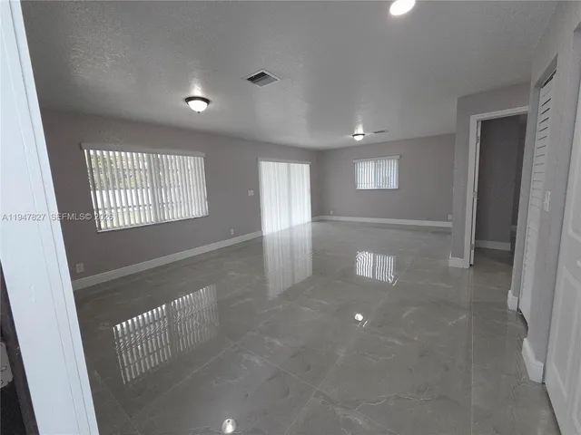 en empty room with windows