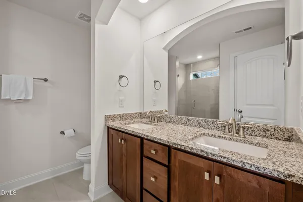 a bathroom with a glass shower door