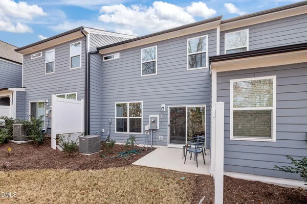 a view of a house with a yard and plants