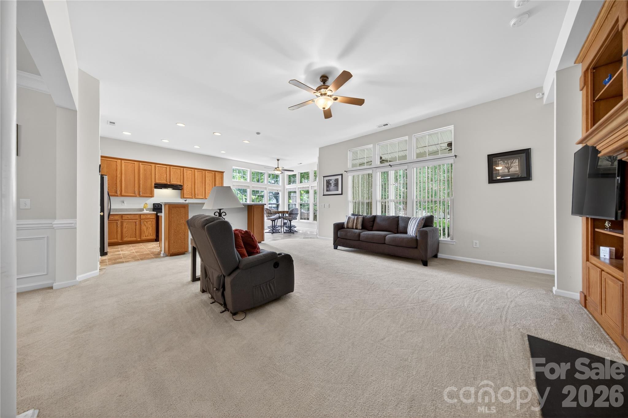 533 Fair Oaks Drive Fort Mill, SC 29708 - Photo 6 of 33 a living room with furniture and a flat screen tv