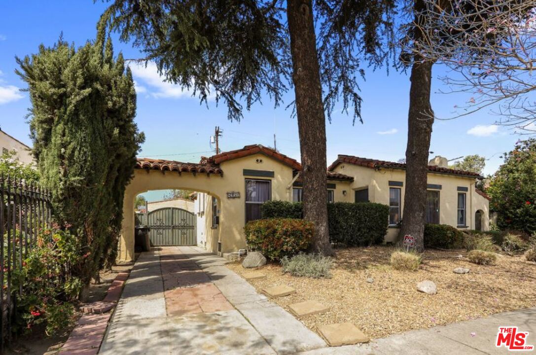 David Avenue Los Angeles, CA 90034 - Photo 2 of 22 a front view of a house with a yard