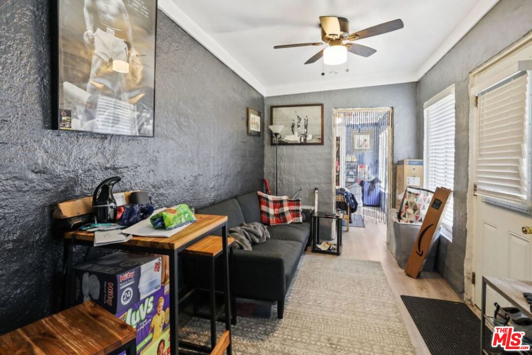 David Avenue Los Angeles, CA 90034 - Photo 14 of 22 a bedroom with furniture and a book shelf