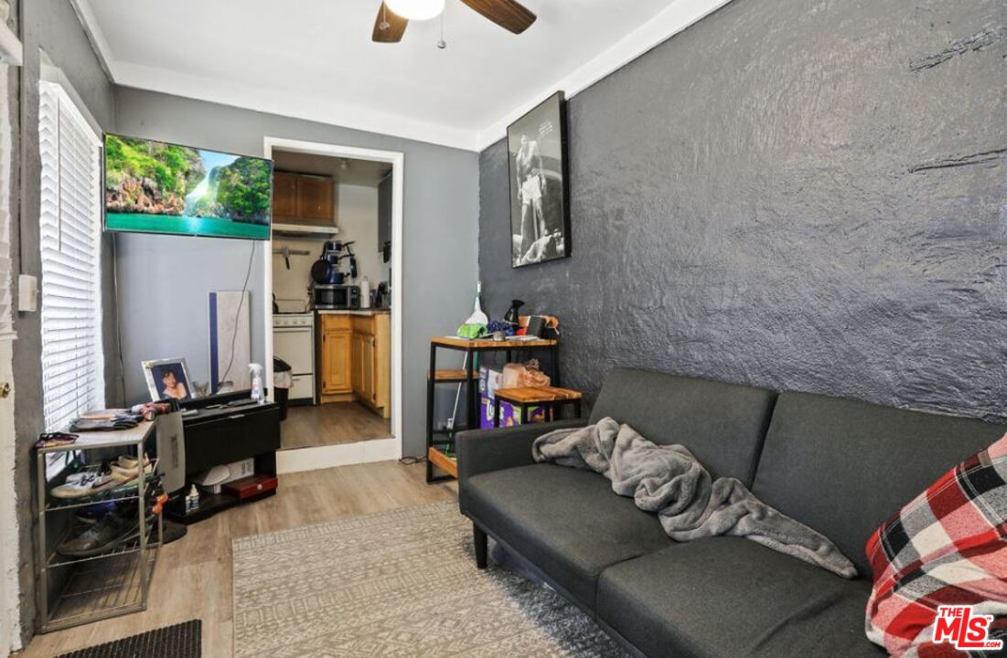 David Avenue Los Angeles, CA 90034 - Photo 15 of 22 a living room with furniture and a flat screen tv