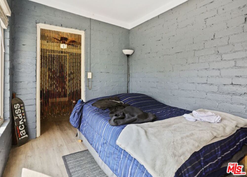 David Avenue Los Angeles, CA 90034 - Photo 16 of 22 a bedroom with a bed and a mirror