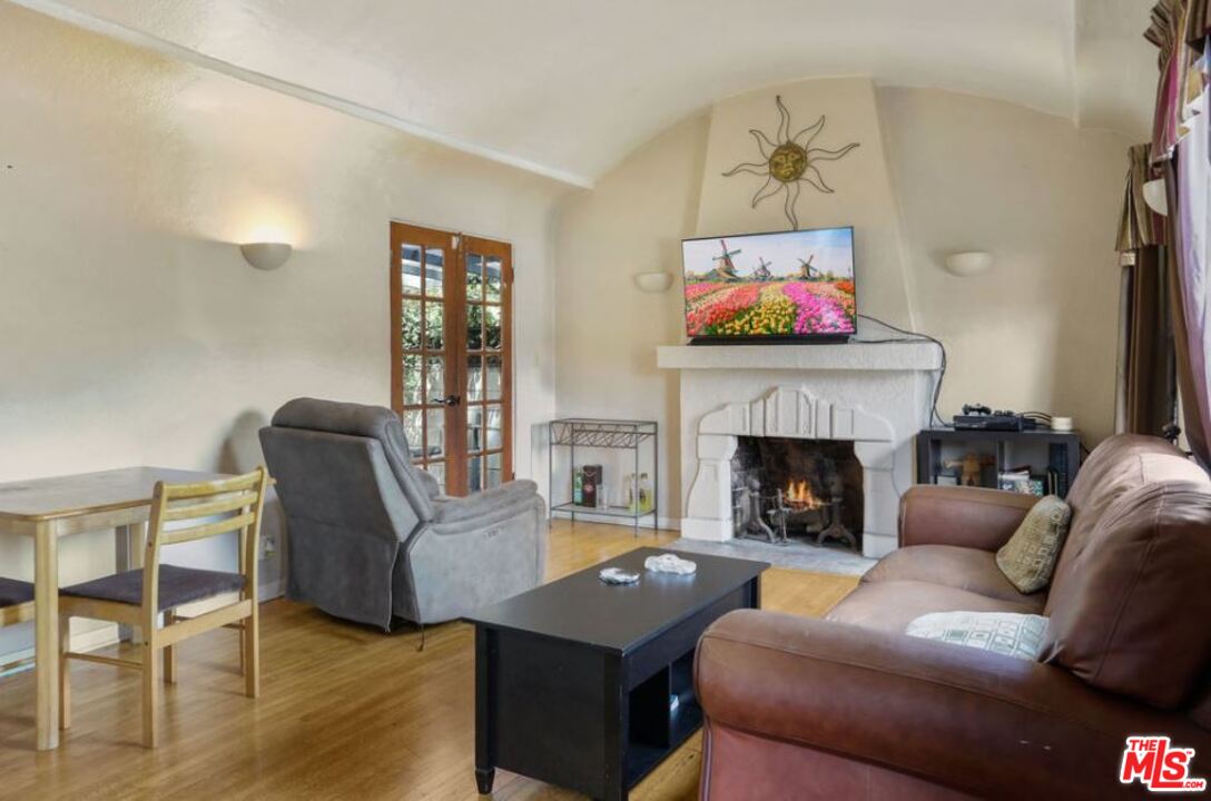 David Avenue Los Angeles, CA 90034 - Photo 3 of 22 a living room with furniture fireplace and window