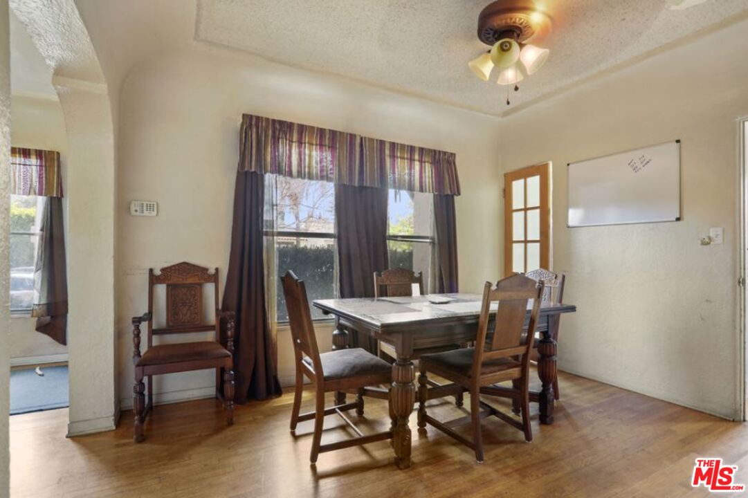 David Avenue Los Angeles, CA 90034 - Photo 6 of 22 a view of a dining room with furniture window and outside view