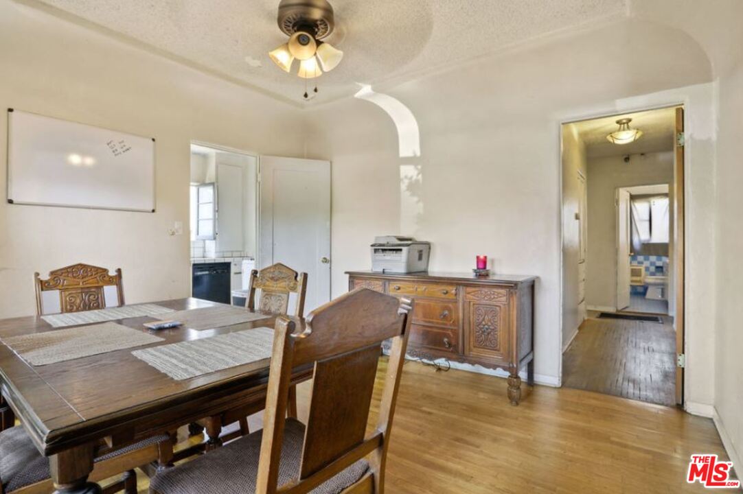 David Avenue Los Angeles, CA 90034 - Photo 7 of 22 a view of a dining room with furniture and wooden floor