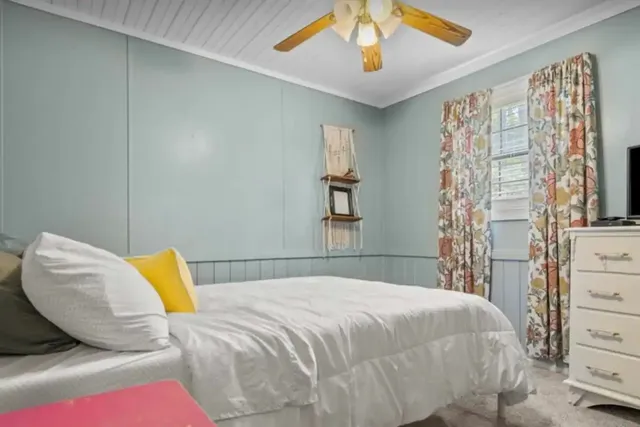 a view of a hallway with wooden floor and closet