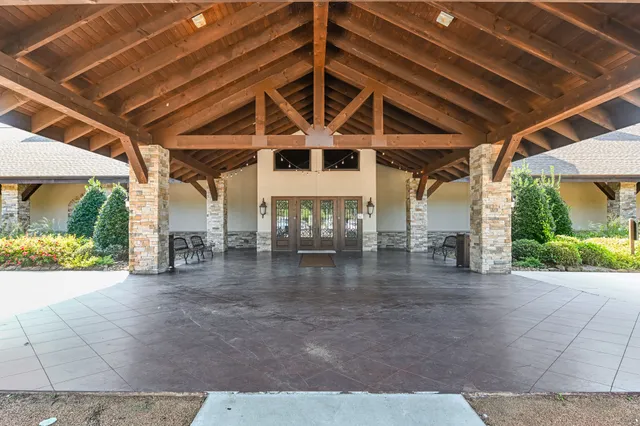 an aerial view of a house with a yard and garden