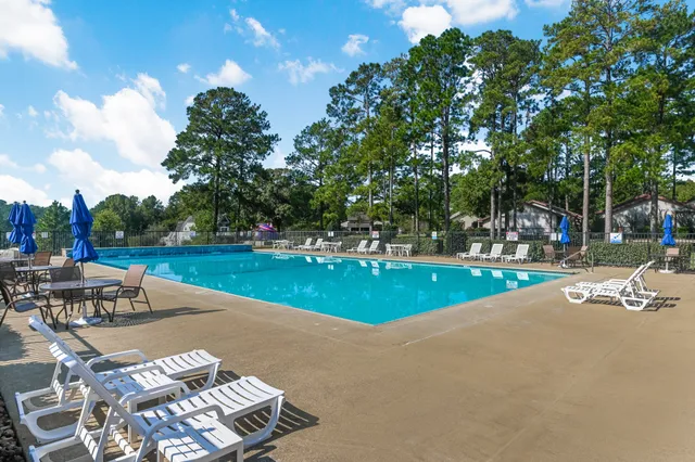 a view of a dinning table and chairs in a patio