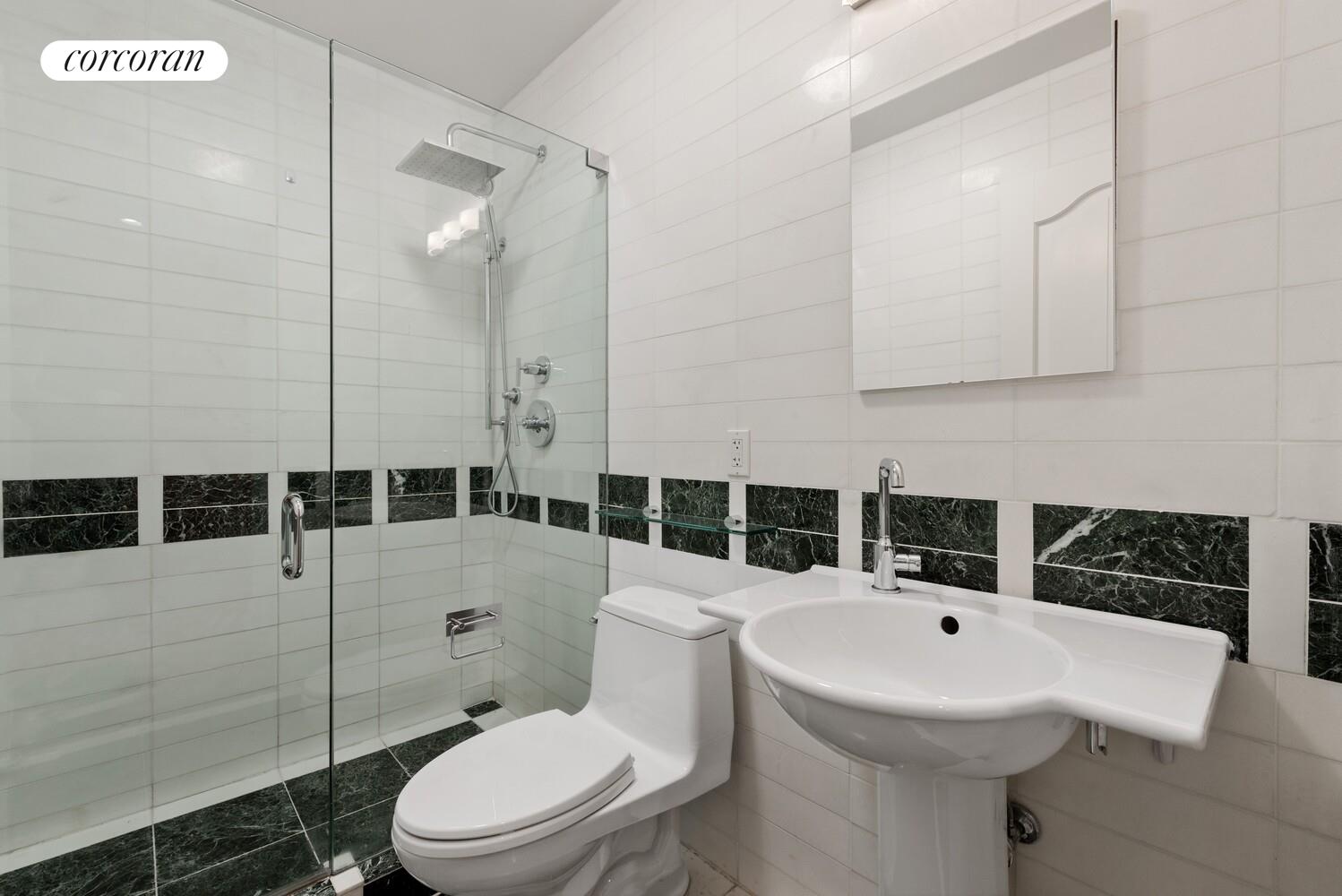 16 East 84th Street, Unit 4AB Manhattan, NY 10028 - Photo 11 of 14 a bathroom with a sink toilet and shower