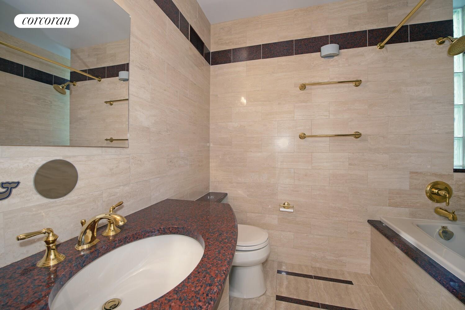 16 East 84th Street, Unit 4AB Manhattan, NY 10028 - Photo 12 of 14 a bathroom with a sink toilet and shower