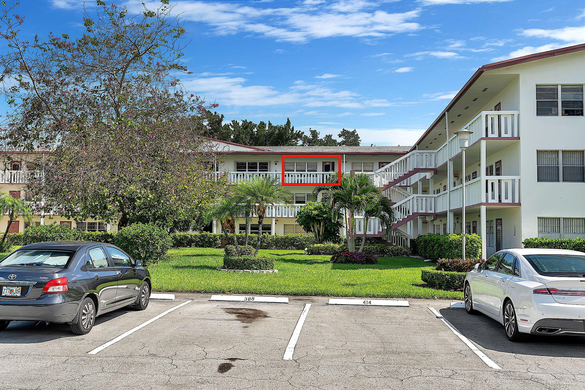a view of a car park in front of house