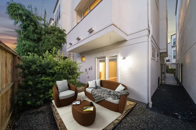 a outdoor space with patio couches and a potted plant