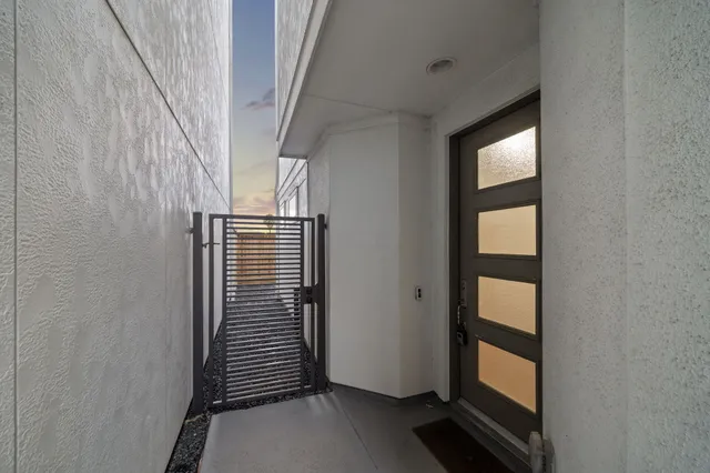 a view of hallway with stairs and wooden floor