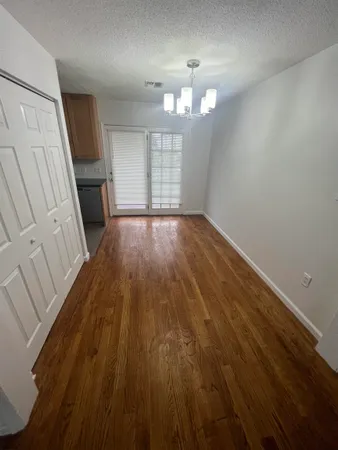 a view of a livingroom with wooden floor